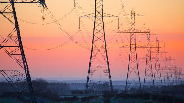 Electricity pylons at daybreak, Derbyshire/Nottinghamshire border, England, United Kingdom, Europe
